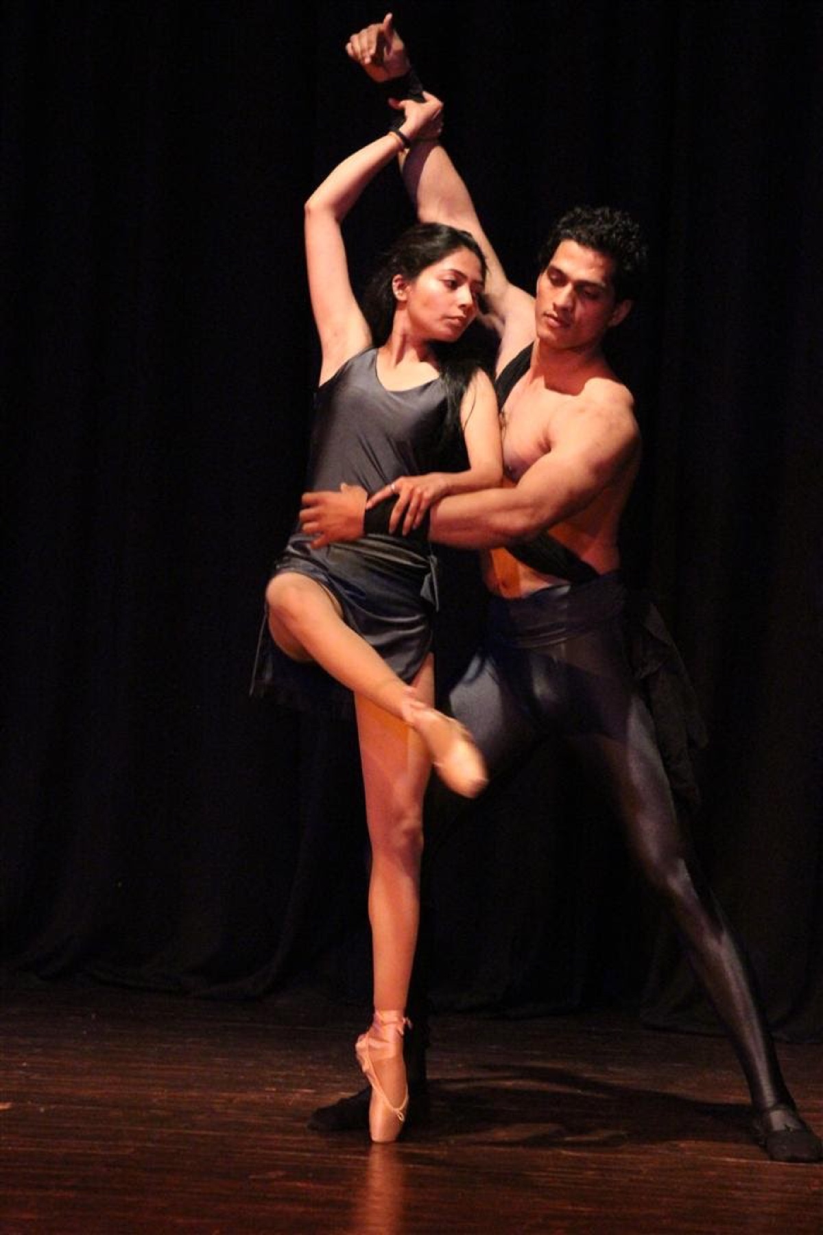 Tapti performing a partnered dance on stage