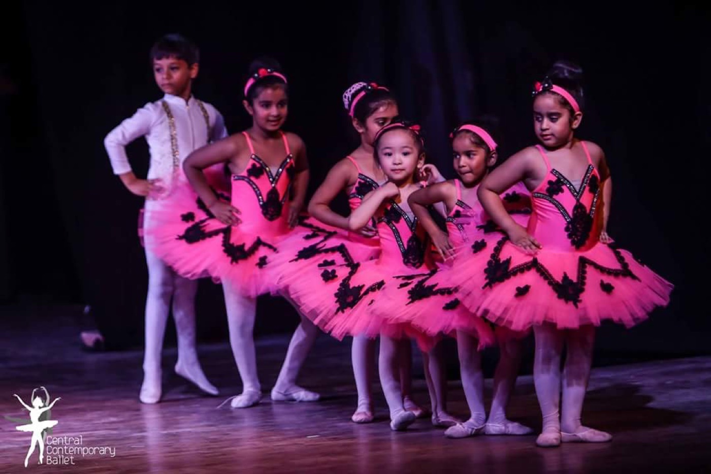 Young dancers sharing a ballet performance