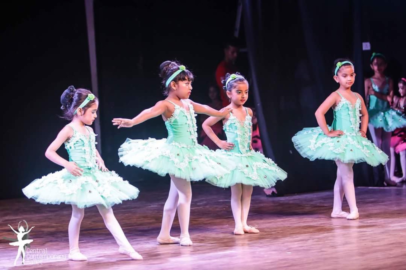 Young ballet dancers performing together on stage